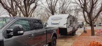 Camper in Snow.webp